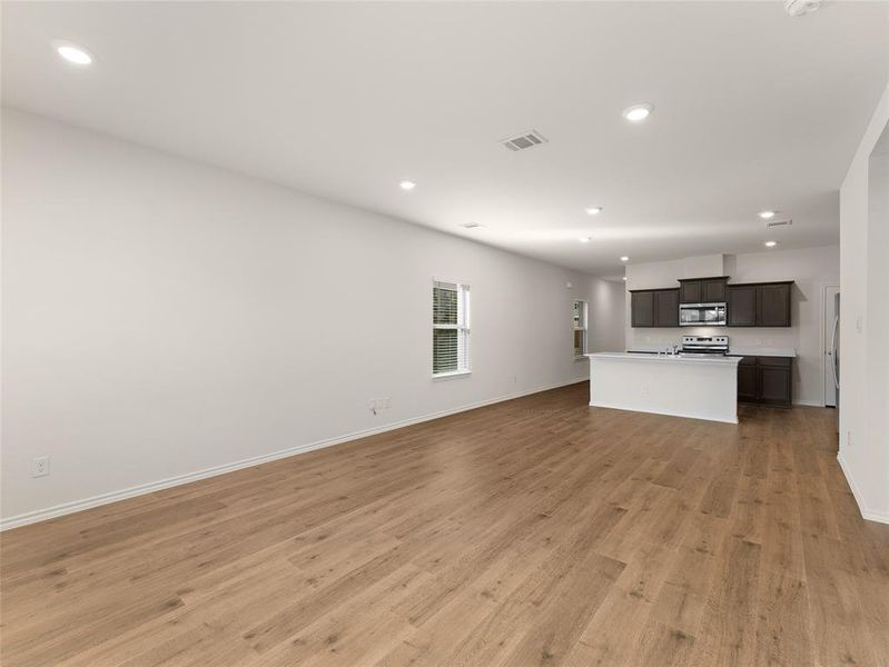 Unfurnished living room featuring light wood-type flooring