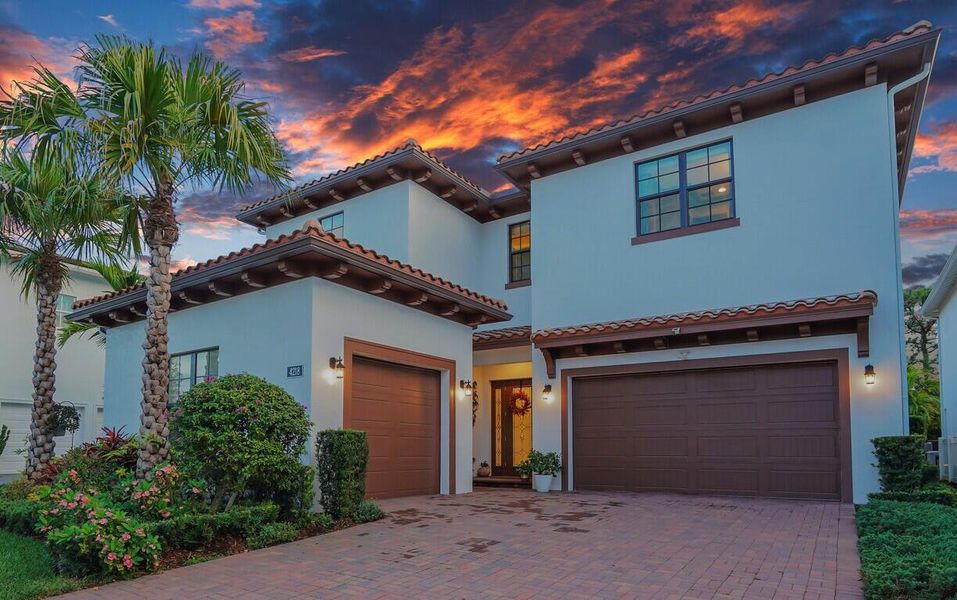 Front exterior of a new home in Alton, Palm Beach Gardens, FL, highlighting curb appeal (Image 1).