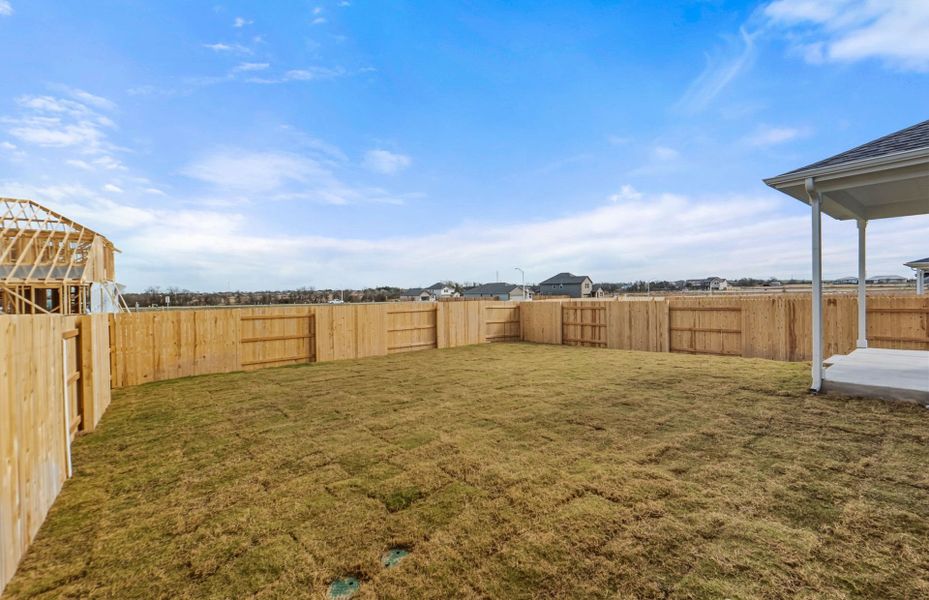 Exterior details and patio area of a home in Patterson Ranch, Georgetown (Image 26).