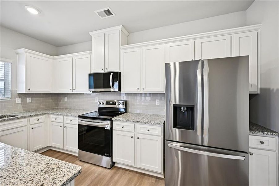 Furnished interior view inside a new home in The Hills at Cedar Creek, Winder (Image 28).