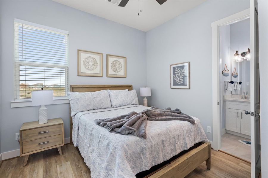 The fourth bedroom on the second floor is spacious and inviting, with soft finishes and natural light that create a comfortable coastal retreat.