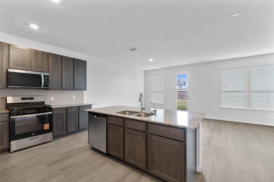 Enjoy a commanding, uninterrupted view from the gourmet kitchen right into the Great Room, ensuring that the home chef is always part of the conversation and keeping everyone seamlessly connected.