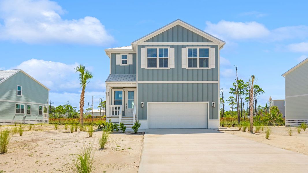 Front exterior of a new home in Redfish Cove at Cape San Blas, Port Saint Joe, FL, highlighting curb appeal (Image 2).