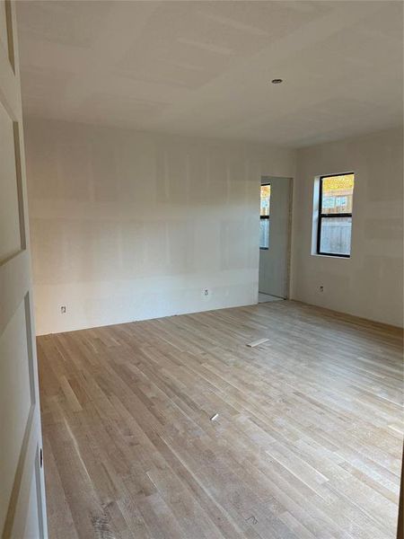 Unfurnished room with wood finished floors Unfurnished room with wood finished floors