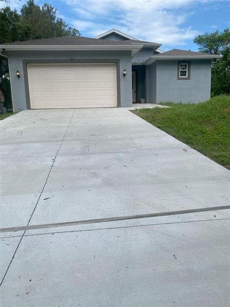 Front exterior of a new home in , Tampa, FL, highlighting curb appeal (Image 1). Front exterior of a new home in , Tampa, FL, highlighting curb appeal (Image 1).