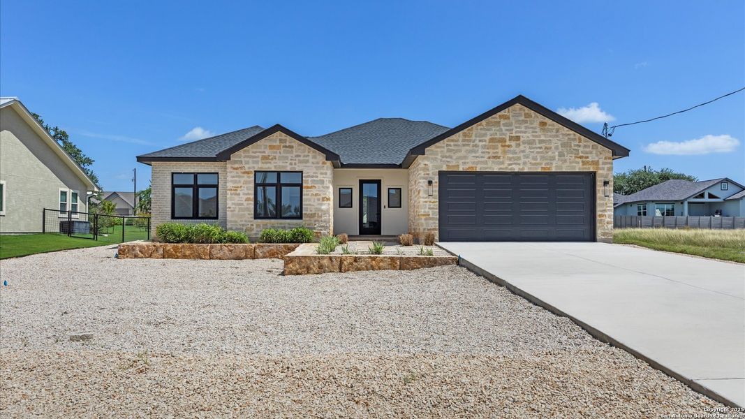 Front exterior of a new home in , Blanco, TX, highlighting curb appeal (Image 25).