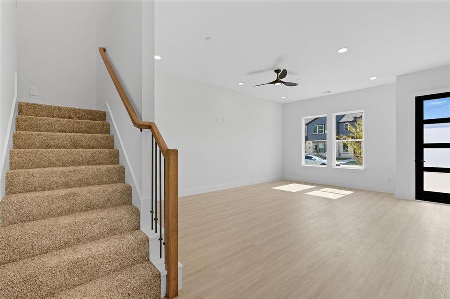 Entryway with light wood-type flooring, recessed lighting, a ceiling fan, and stairway