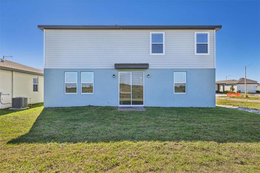 Exterior details and patio area of a home in Lake Deer Estates - Signature Series, Poinciana (Image 23).