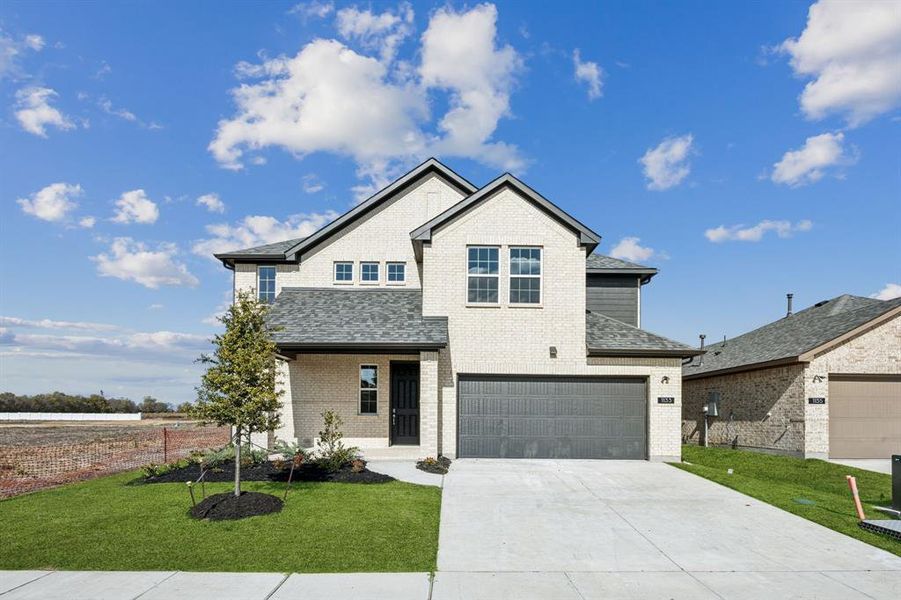 Front exterior of a new home in Santorini, Seagoville, TX, highlighting curb appeal (Image 1).