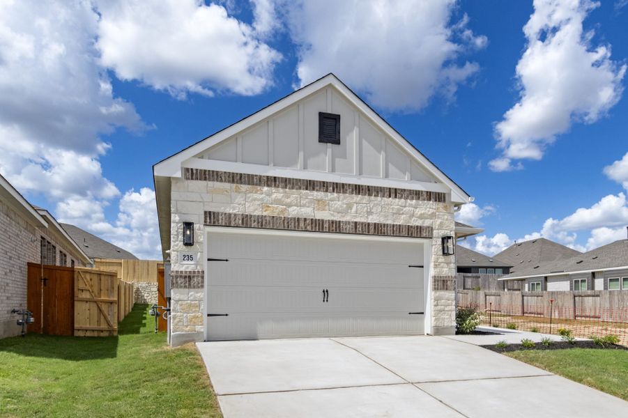 Front exterior of a new home in Crosswinds, Kyle, TX, highlighting curb appeal (Image 24).