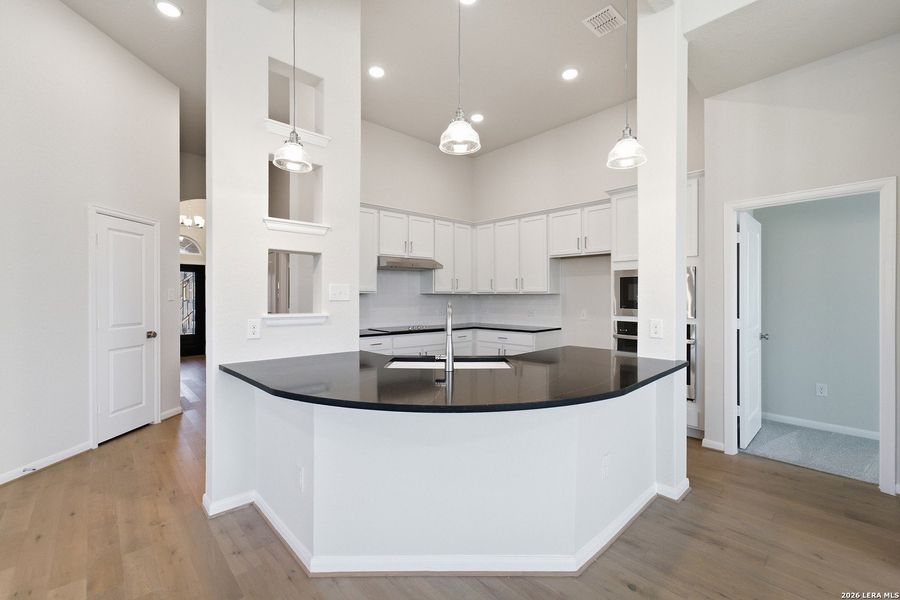 Furnished interior view inside a new home in The Woodlands at Medina Hills, Mico (Image 12).