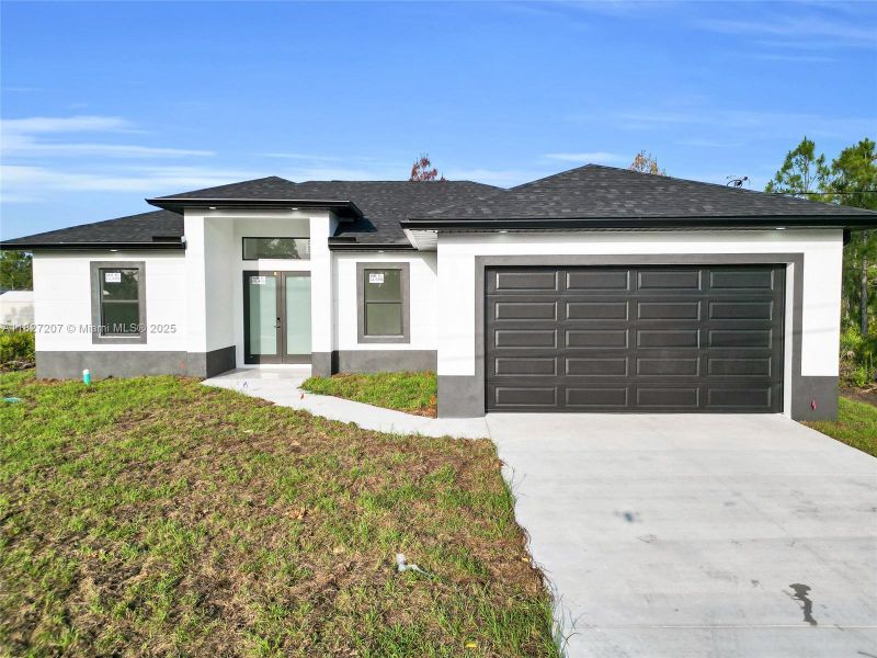 Front exterior of a new home in , Lehigh Acres, FL, highlighting curb appeal (Image 2). Front exterior of a new home in , Lehigh Acres, FL, highlighting curb appeal (Image 2).