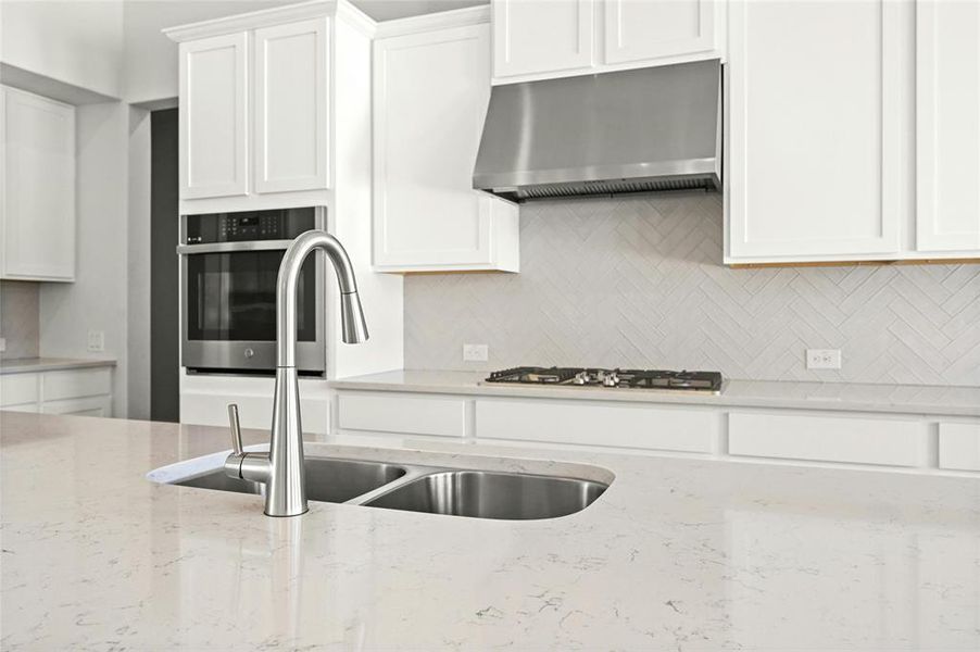 Quartz Countertops and stainless steel appliances.