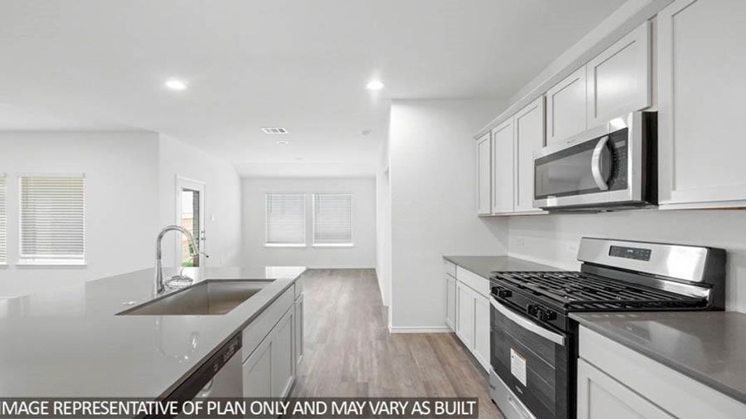 Furnished interior view inside a new home in Sunterra, Katy (Image 10).