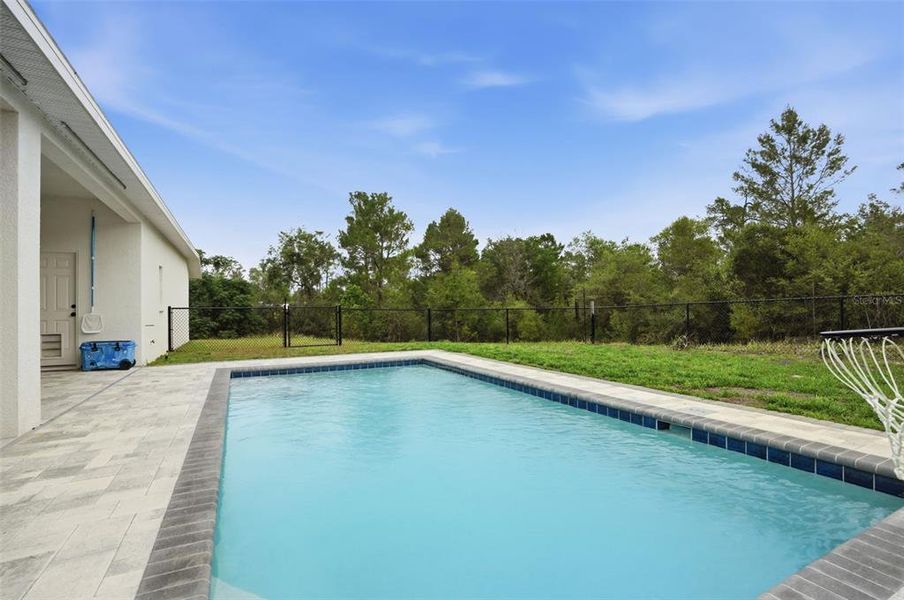 Exterior details and patio area of a home in , Weeki Wachee (Image 22).