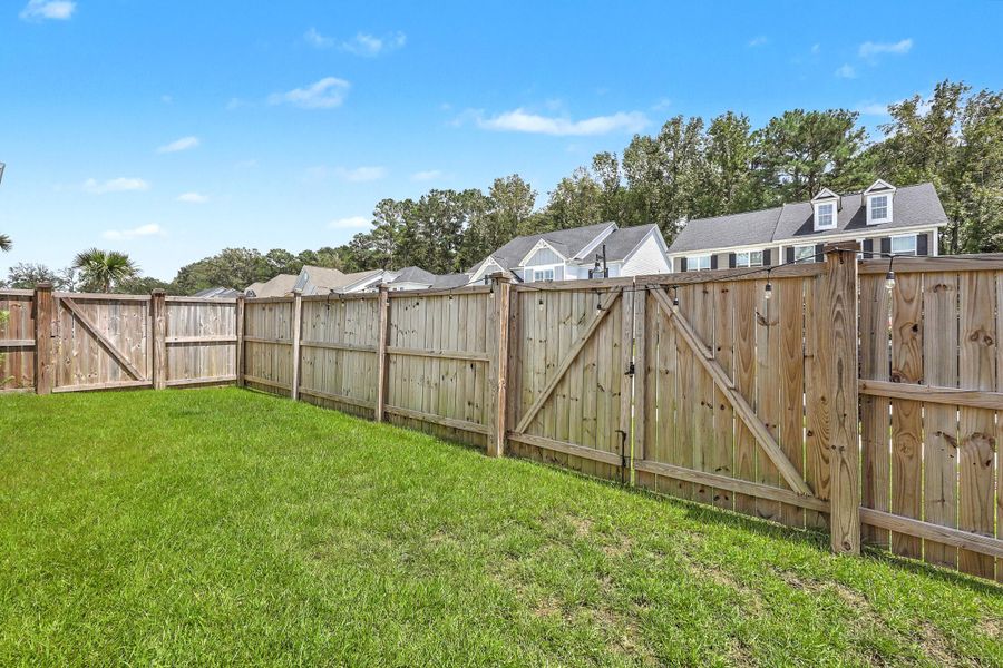 Exterior details and patio area of a home in , Johns Island (Image 25).