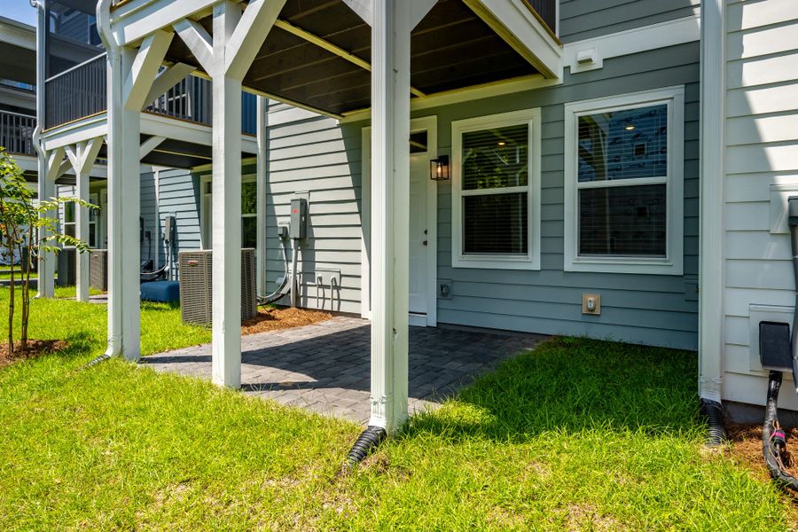 Exterior details and patio area of a home in The Bluffs at Pinefield Townhomes, Charleston (Image 3). Exterior details and patio area of a home in The Bluffs at Pinefield Townhomes, Charleston (Image 3).