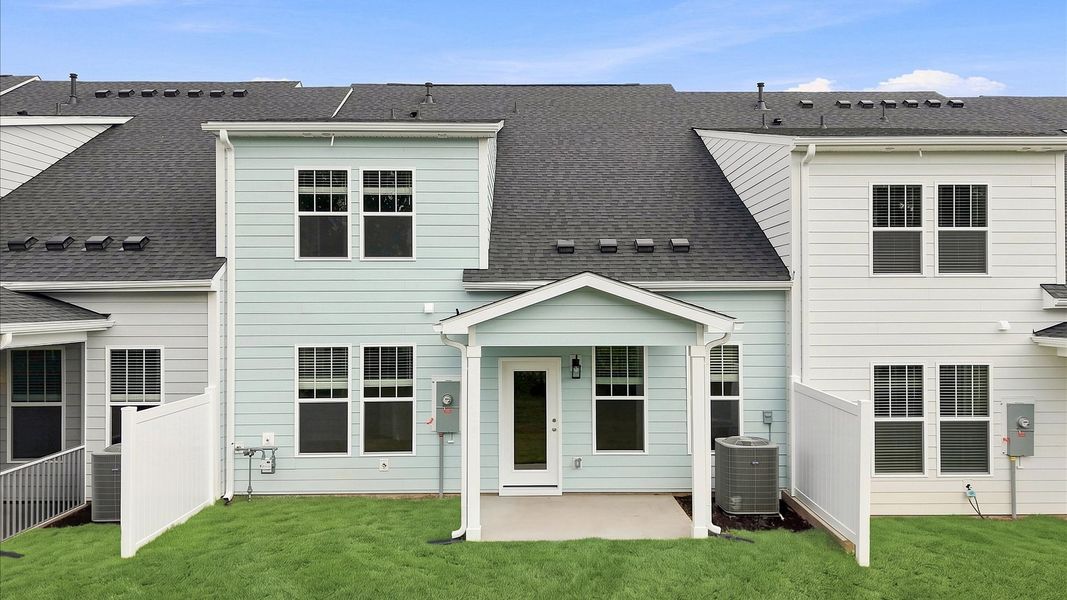 Vibrant rear outdoor space featuring a covered porch and exceptional craftsmanship in Anderson, SC