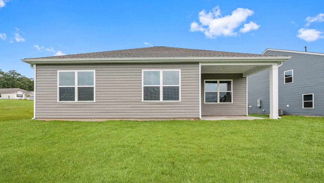 Exterior details and patio area of a home in Durbin Meadows Traditions, Fountain Inn (Image 3).