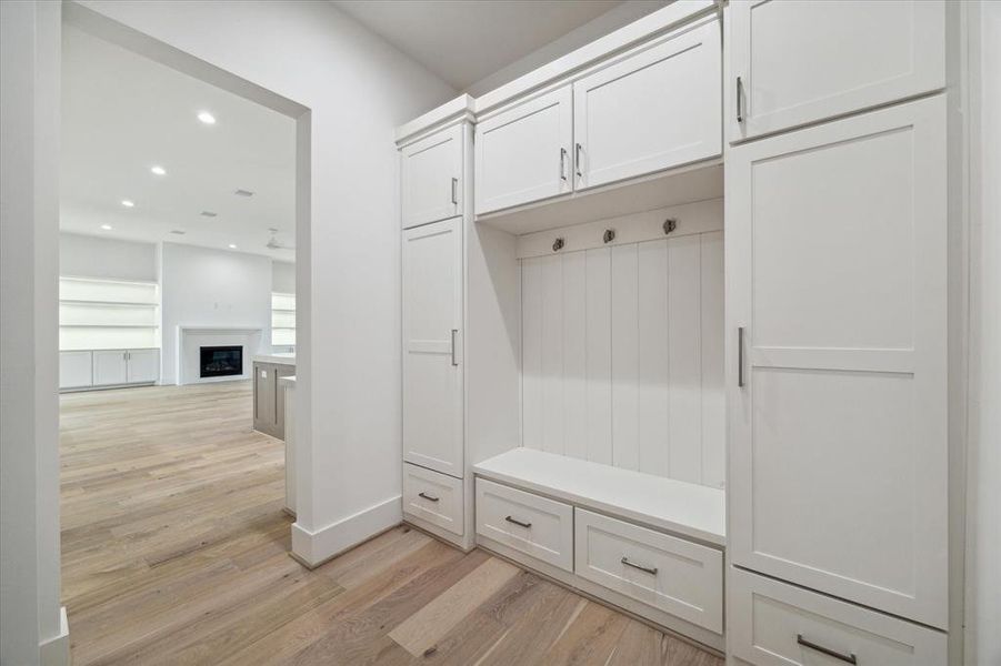 Mud room vestibule from garage to kitchen / family room. The downstairs component of the elevator shaft is located in the mud room.