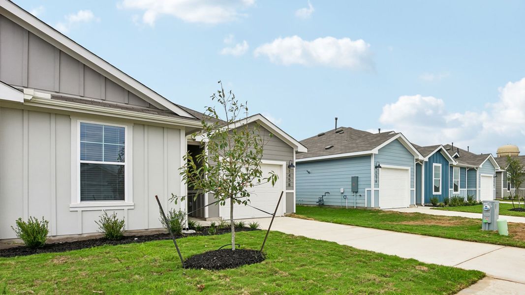 Front exterior of a new home in Wayside, Uhland, TX, highlighting curb appeal (Image 22). Front exterior of a new home in Wayside, Uhland, TX, highlighting curb appeal (Image 22).