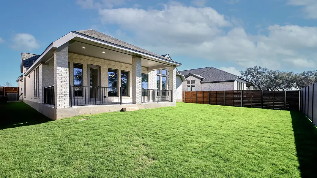 Exterior details and patio area of a home in Juniper Springs, Lockhart (Image 2).