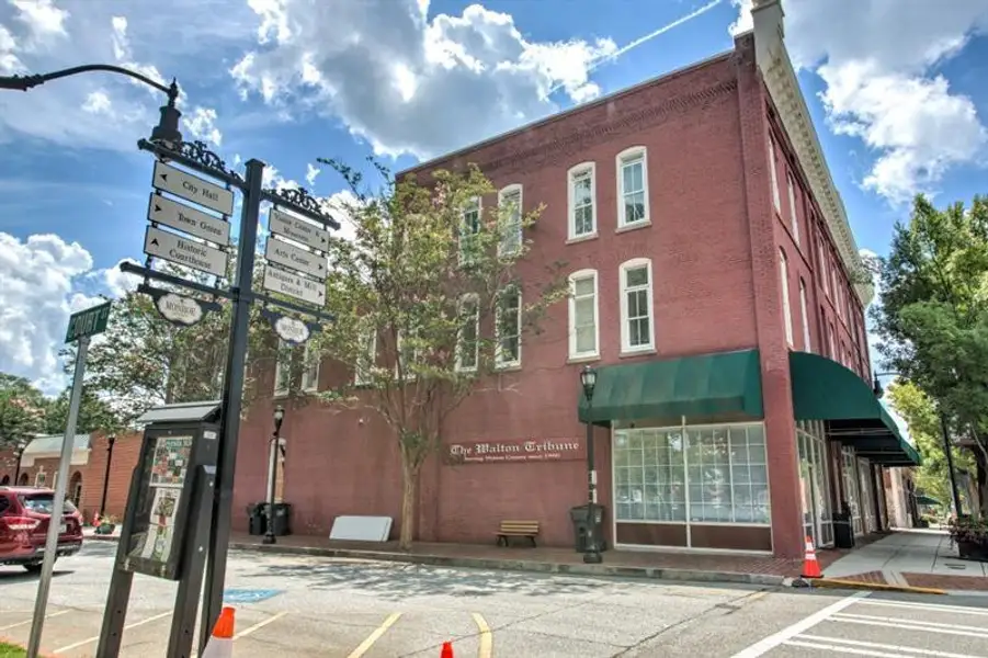 Front exterior of a new home in Pinegate, Covington, GA, highlighting curb appeal (Image 26).