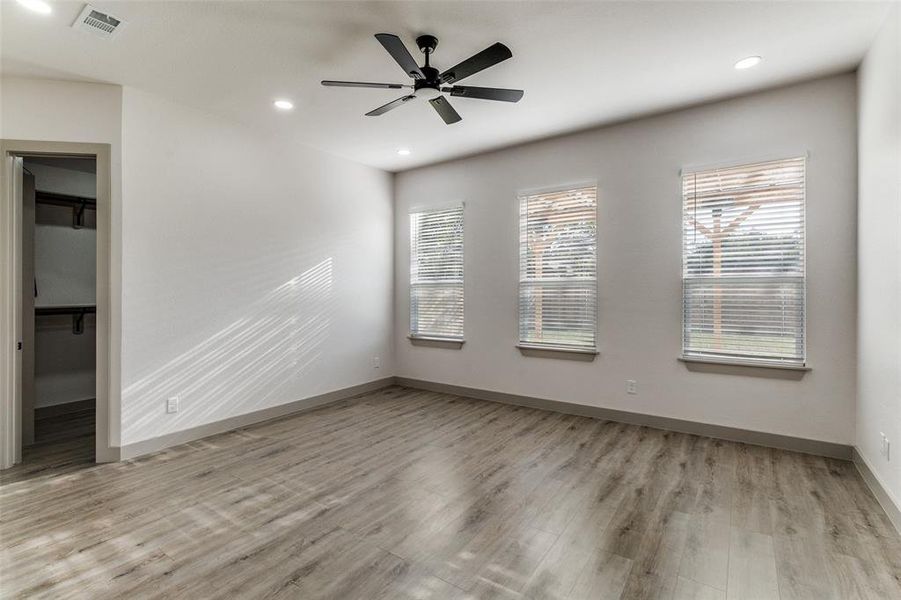 Unfurnished room with light wood-style floors, recessed lighting, and a ceiling fan Unfurnished room with light wood-style floors, recessed lighting, and a ceiling fan