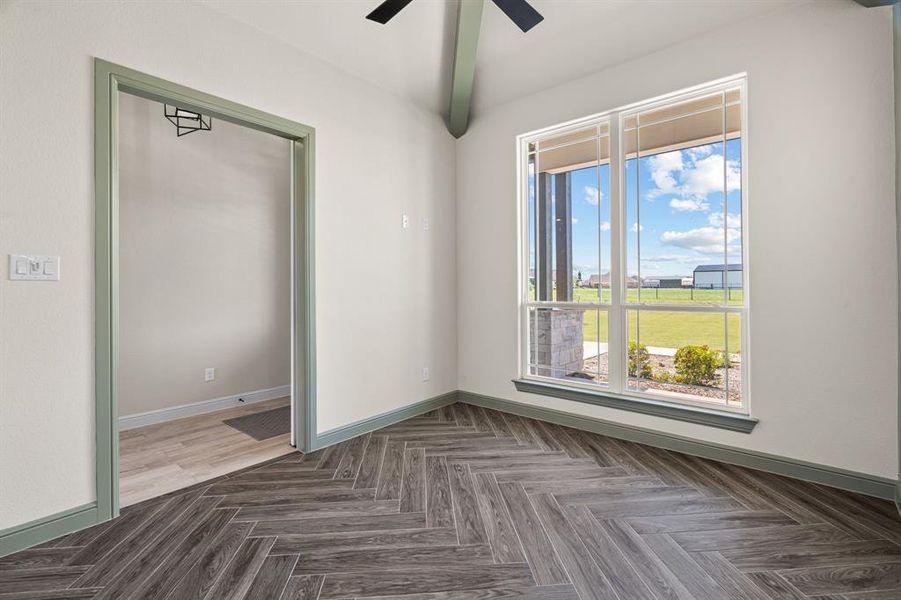 Great View of the Wood-Look Tile Floors, Ceiling Fan & Natural Light