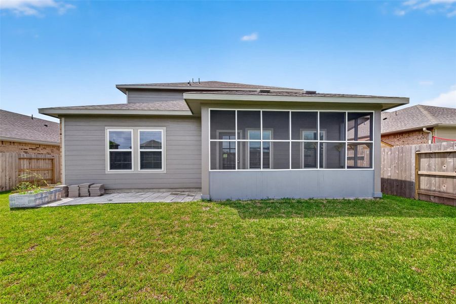 Exterior details and patio area of a home in Heights of Barbers Hill, Baytown (Image 26).