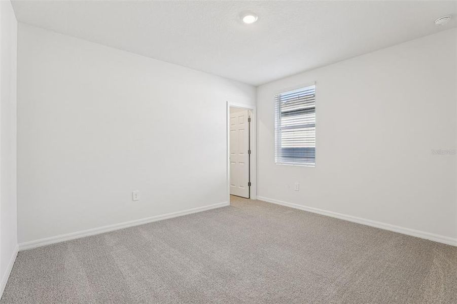 Spacious, unfurnished interior of a new home in Lake Deer Estates - Signature Series, Poinciana (Image 33).