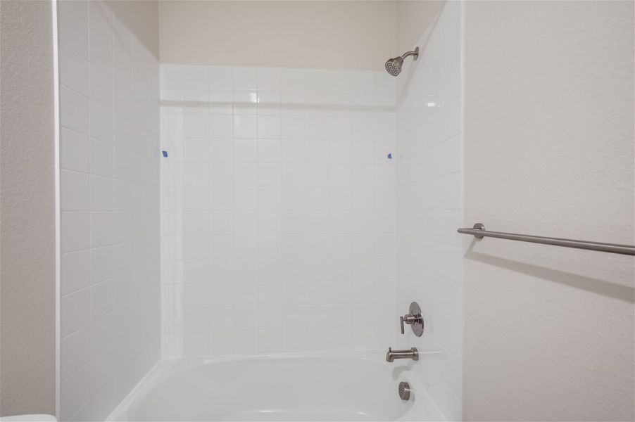 A bathtub in a bathroom. A bathtub in a bathroom.