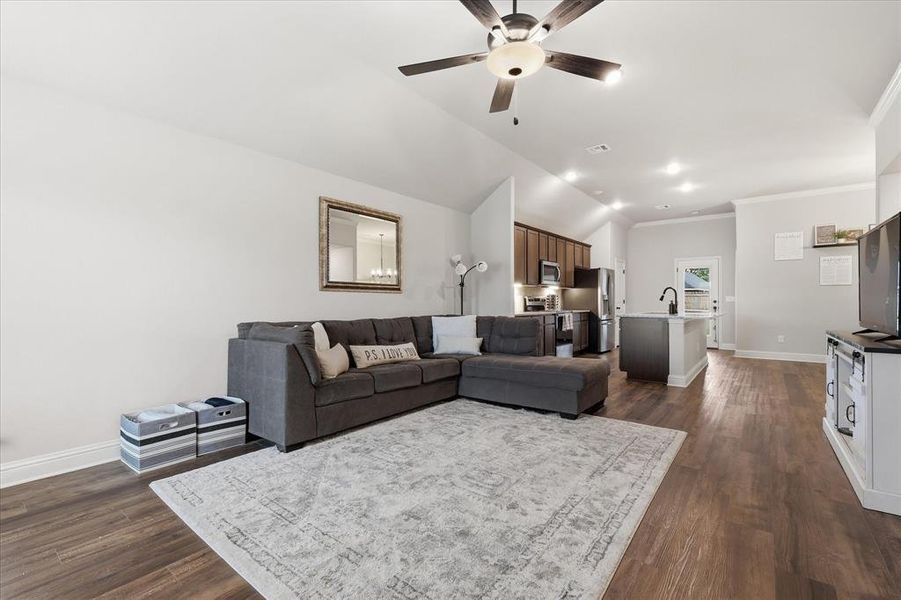 Open-concept living and kitchen area offering a bright, connected space perfect for everyday living and entertaining.