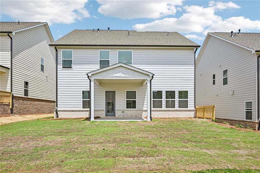 Exterior details and patio area of a home in Eastlyn Crossing, Flowery Branch (Image 3).