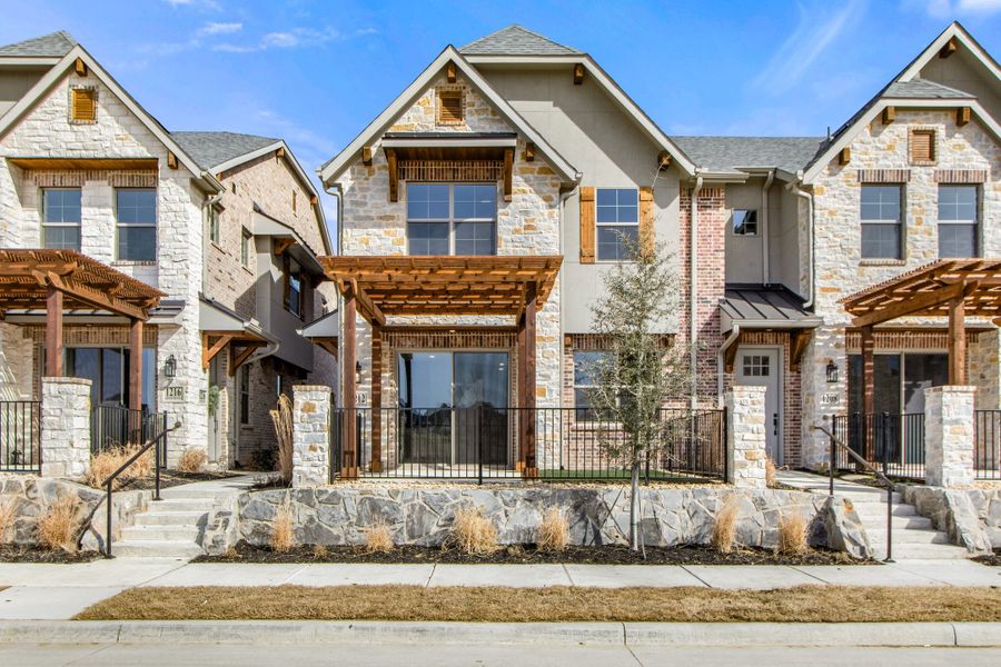 Front exterior of a new home in The Tribute, The Colony, TX, highlighting curb appeal (Image 1). Front exterior of a new home in The Tribute, The Colony, TX, highlighting curb appeal (Image 1).