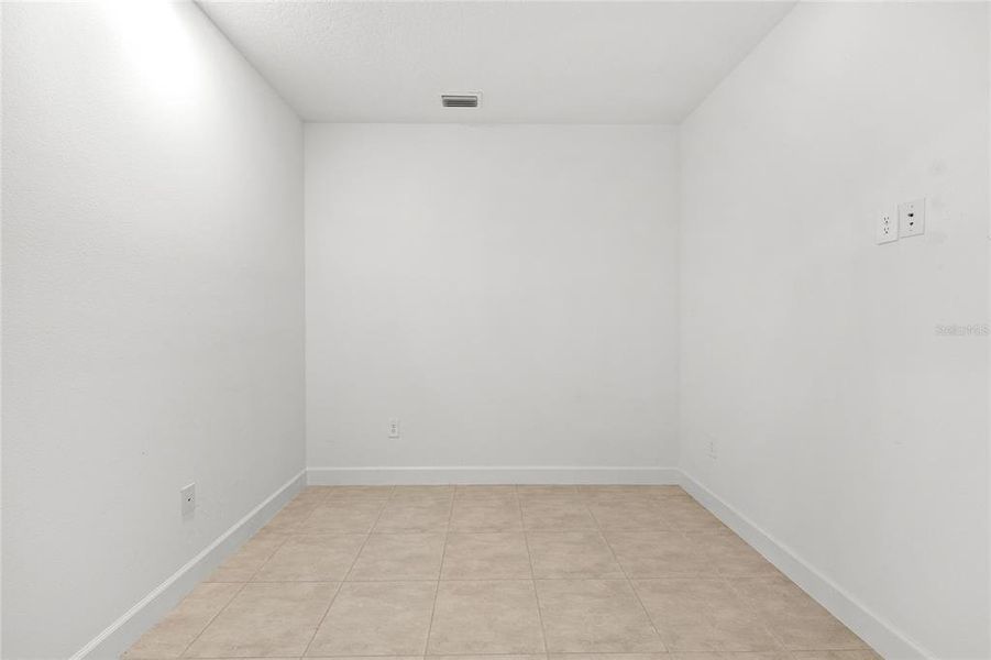 Spacious, unfurnished interior of a new home in Harvest At Ovation 50s, Winter Garden (Image 23).