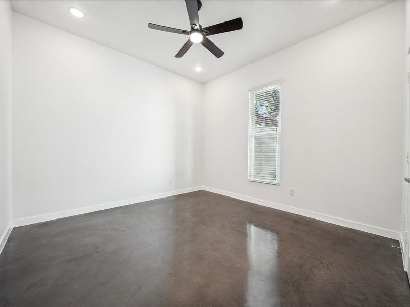 Spare room with ceiling fan