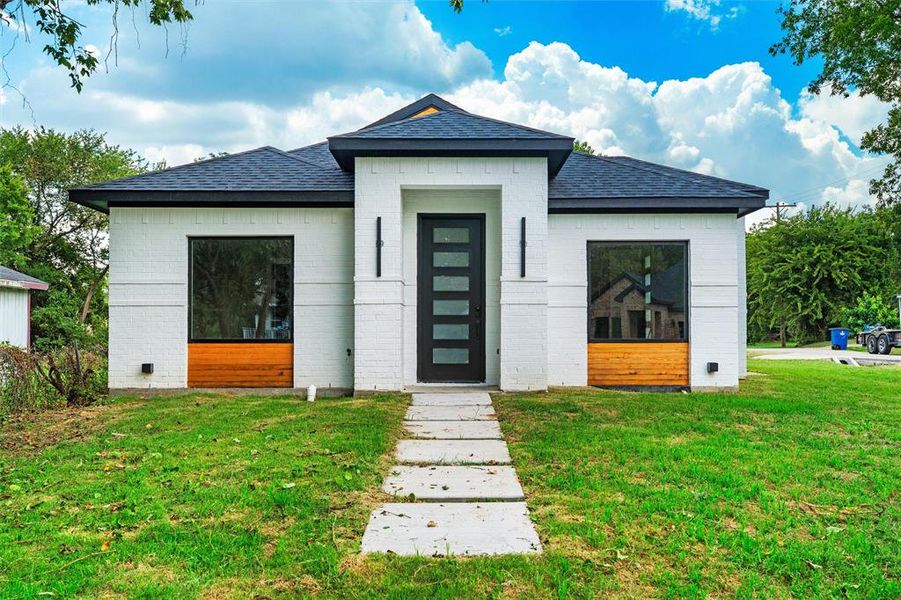 Front exterior of a new home in , Ennis, TX, highlighting curb appeal (Image 18). Front exterior of a new home in , Ennis, TX, highlighting curb appeal (Image 18).