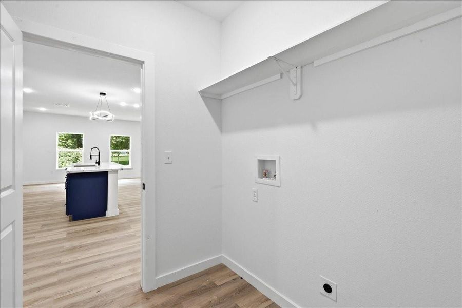 Dedicated laundry/utility room complete with built-in storage shelving and washer/dryer hookups. Dedicated laundry/utility room complete with built-in storage shelving and washer/dryer hookups.