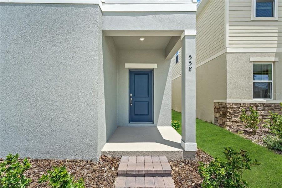 Exterior details and patio area of a home in Spring Walk at the Junction, Debary (Image 4).