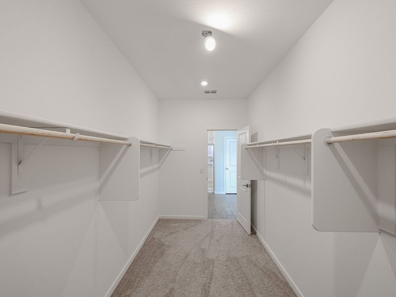 A hallway with white walls.