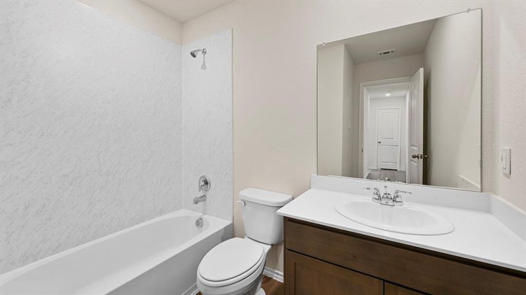 Bathroom featuring vanity and bathtub / shower combination
