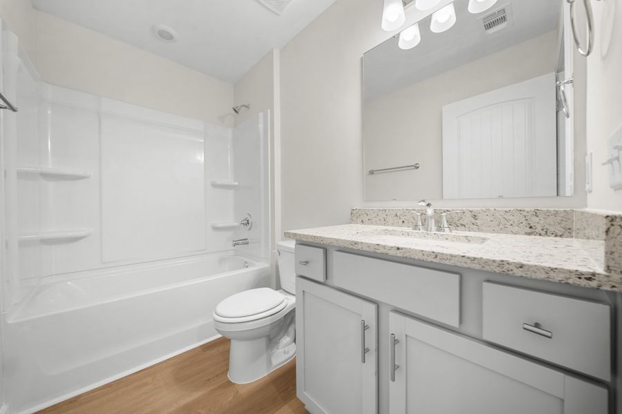 Representative furnished interior of a home built from the The Holly by Smith Family Homes in Belair East, Statesboro (Image 12).