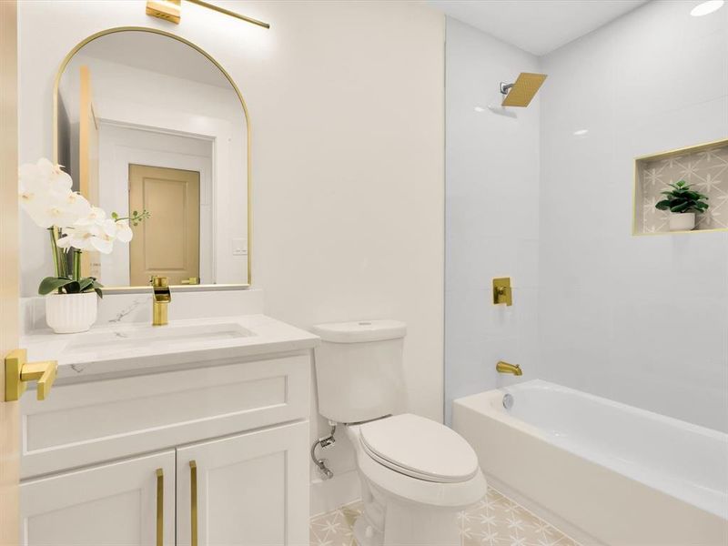 Full bathroom featuring shower / bathing tub combination, vanity, and toilet