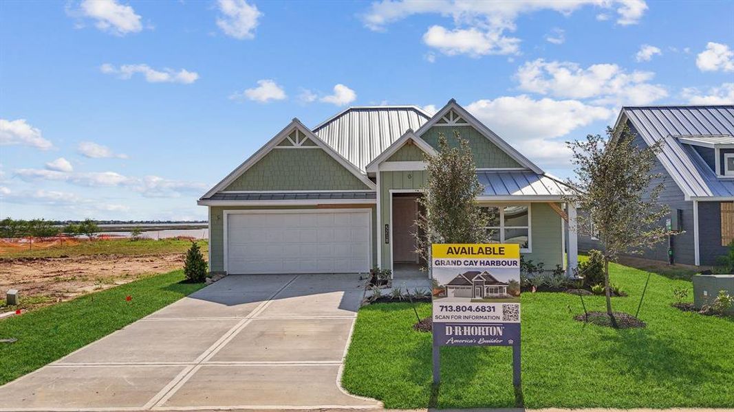 Front exterior of a new home in Grand Cay Harbour, Texas City, TX, highlighting curb appeal (Image 18). Front exterior of a new home in Grand Cay Harbour, Texas City, TX, highlighting curb appeal (Image 18).