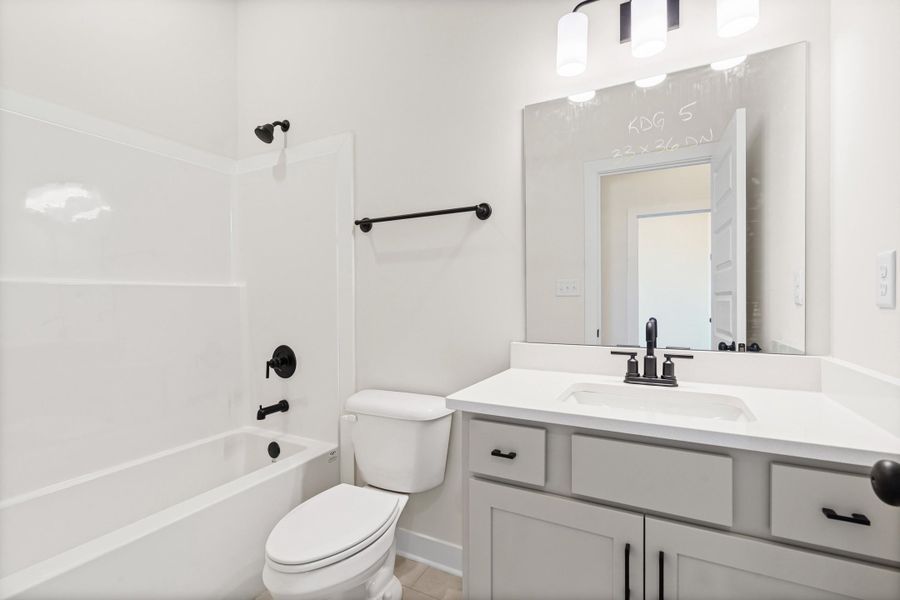 Full bath featuring vanity and washtub / shower combination Full bath featuring vanity and washtub / shower combination