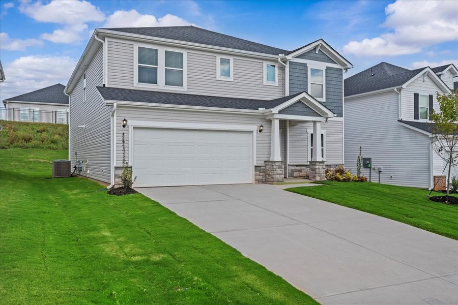 Front exterior of a new home in The Farm at Wells Creek - Signature Collection, Gray Court, SC, highlighting curb appeal (Image 2).