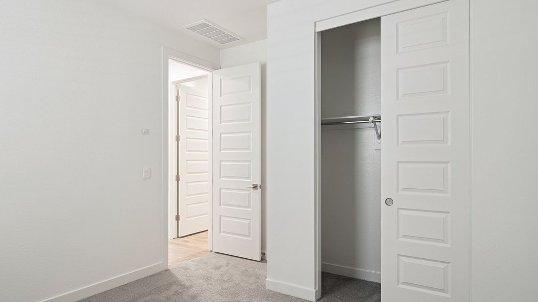 Representative unfurnished interior of a home built from the Hayden by D.R. Horton in The Ridge at Stone Butte, Phoenix (Image 29).