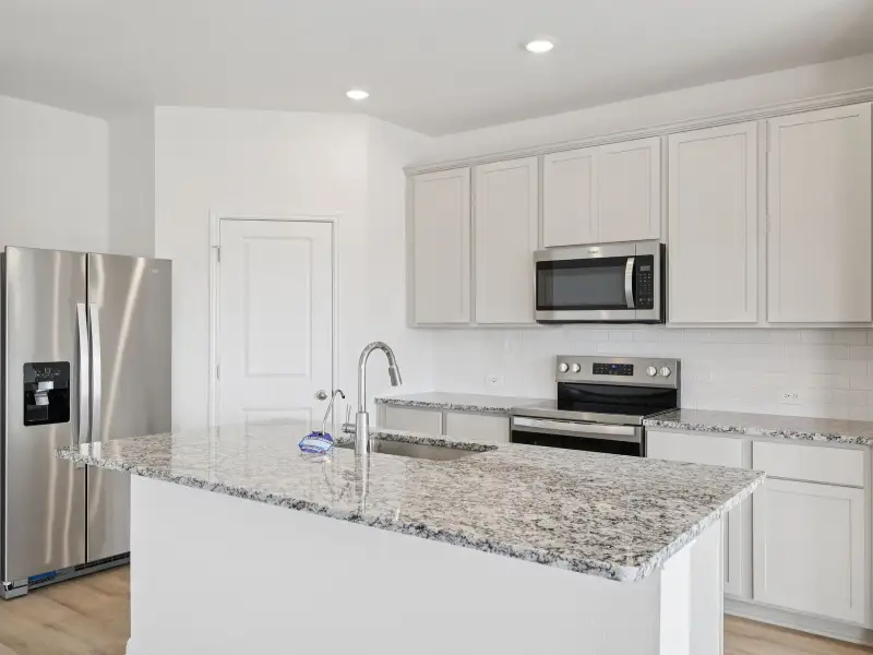 Furnished interior view inside a new home in Creekfall, Burnet (Image 3).