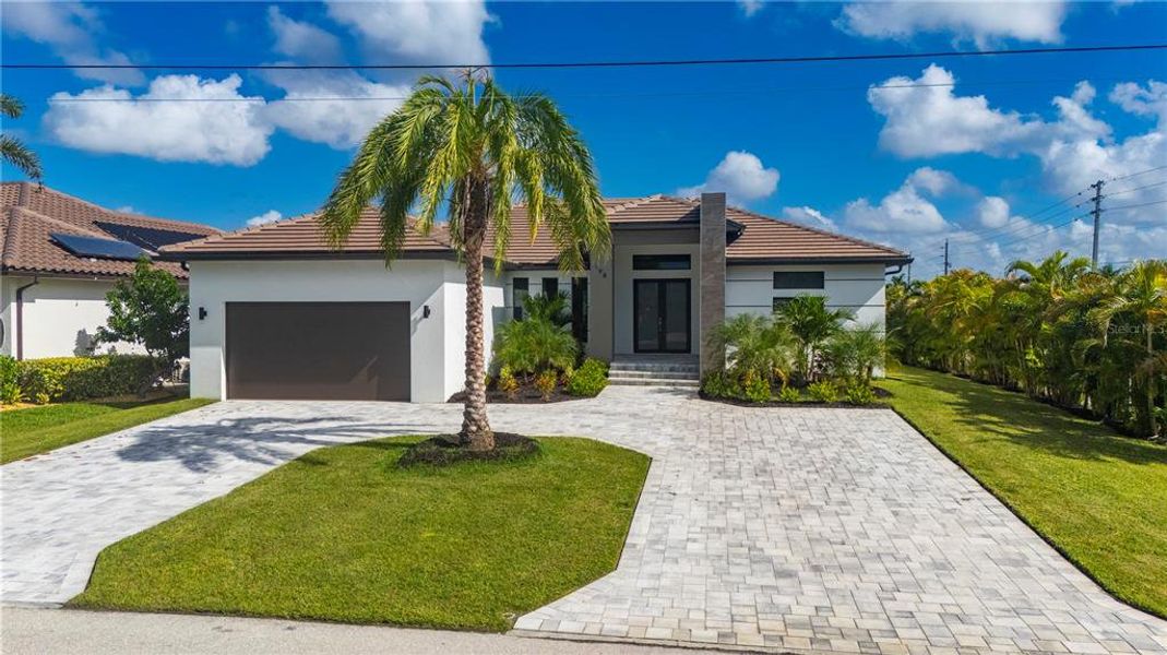 Front exterior of a new home in , Punta Gorda, FL, highlighting curb appeal (Image 2).